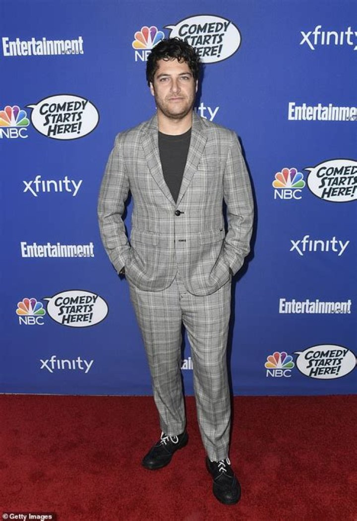 Adam Pally Posing for his Instagram feed by wearing a cap.