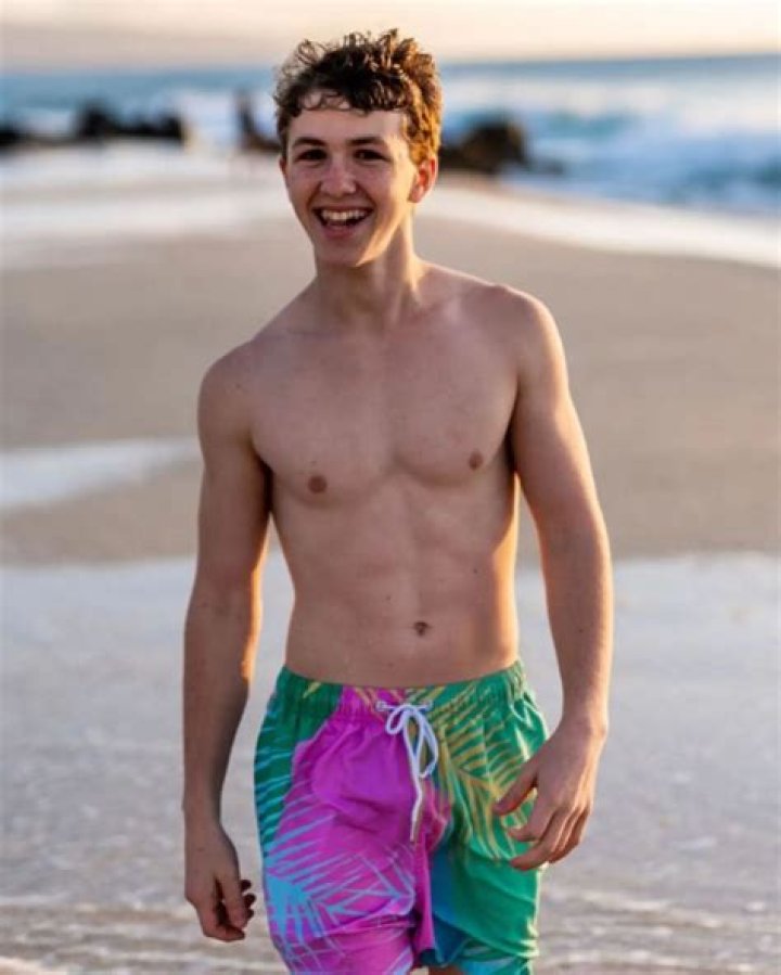Ethan Wacker posing for the photo showing his sixpacks
