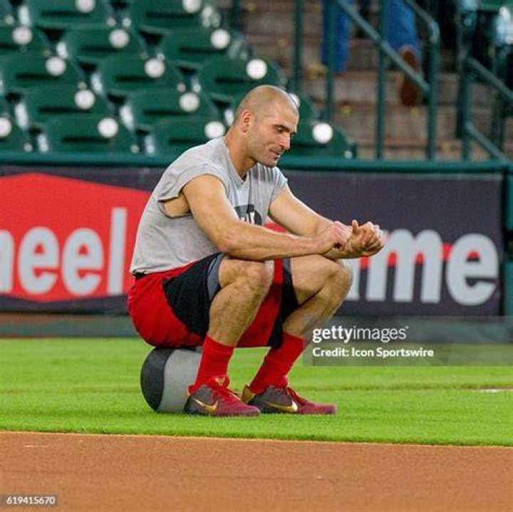 Joey Votto working out in a gym