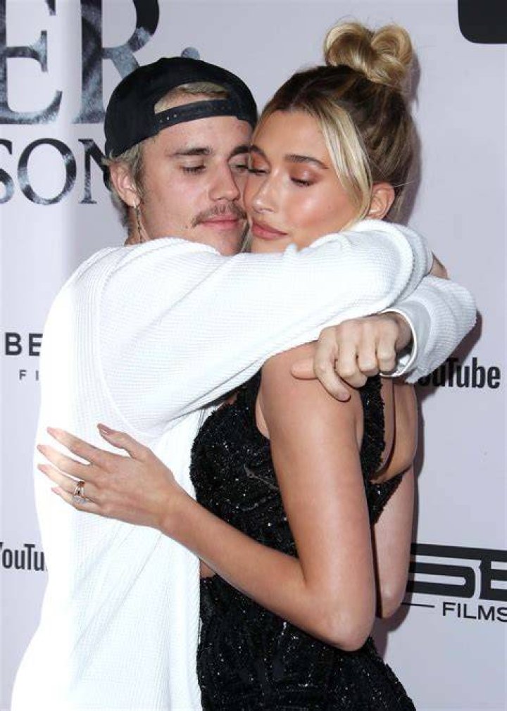Justin Bieber takes Hailey Baldwin for a stroll ahead of another date night at the movie's
